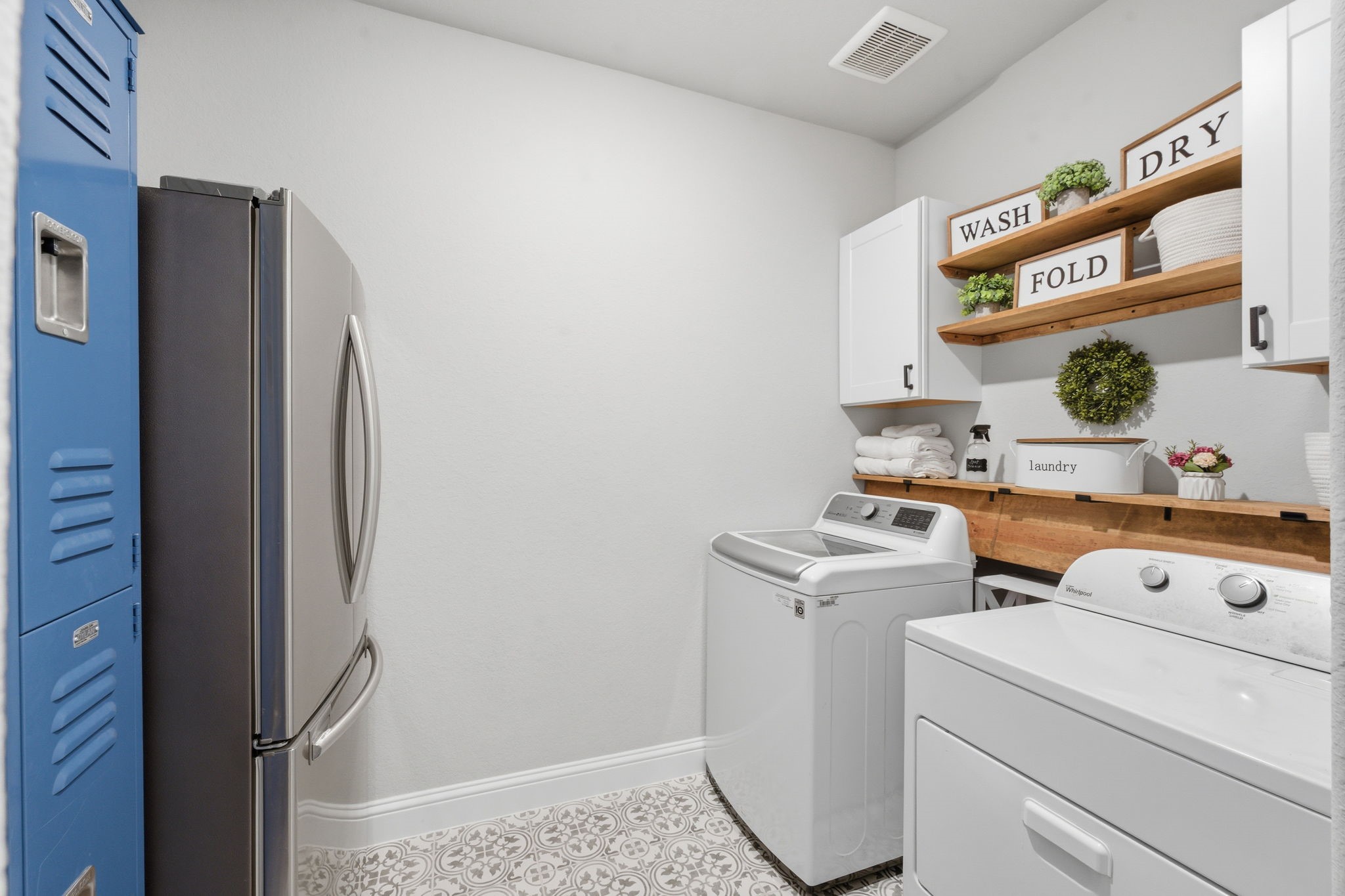 4242 Orchard Pass Drive Spring, TX 77386 - Photo 31 of 50 Adorable Laundy Room w/Decorative Tile Floors, Large Enough for a Refrigerator and More! Plumbed for Gas or Electric Dryer.
