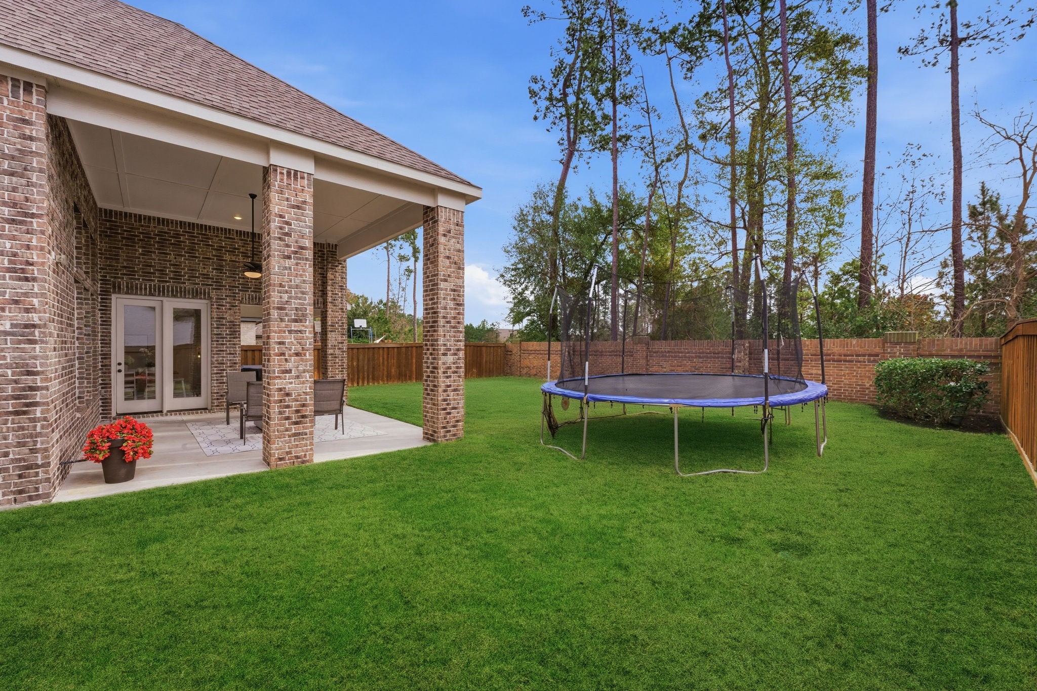 4242 Orchard Pass Drive Spring, TX 77386 - Photo 43 of 50 View from the side rear yard. Gas Plumb out is ready for your grill or ideal for an outdoor kitchen. No Neighbors behind! Sprinkler System!