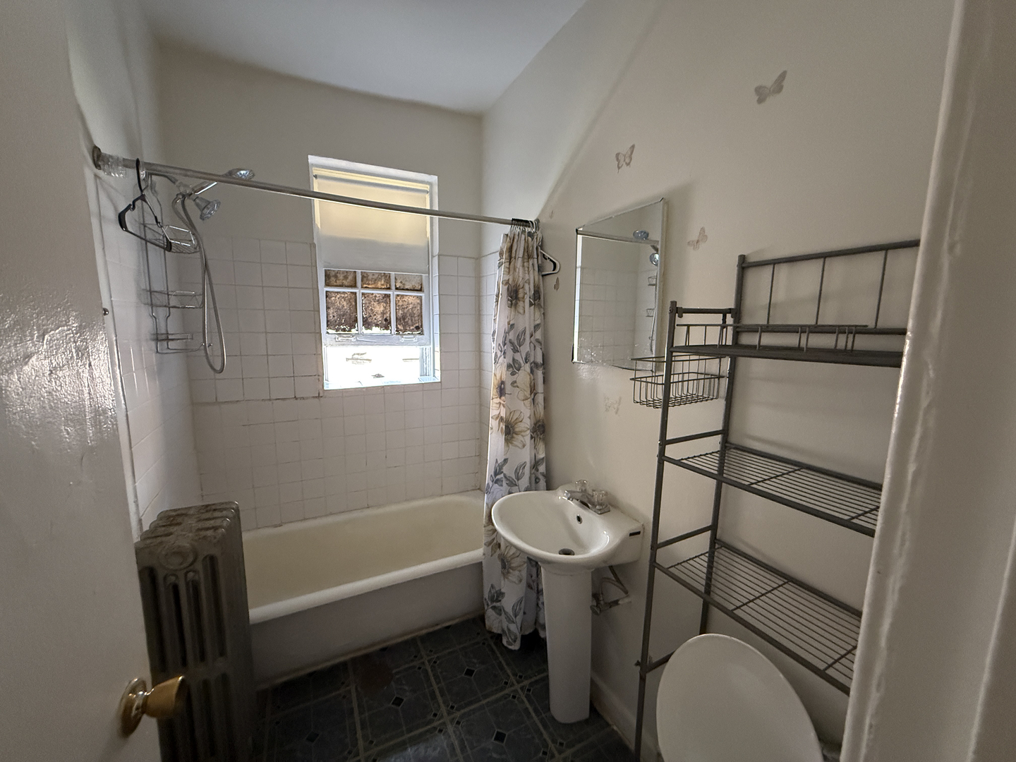 7415 North Damen Avenue, Unit 2E Chicago, IL 60645 - Photo 8 of 8 a bathroom with a sink toilet and shower