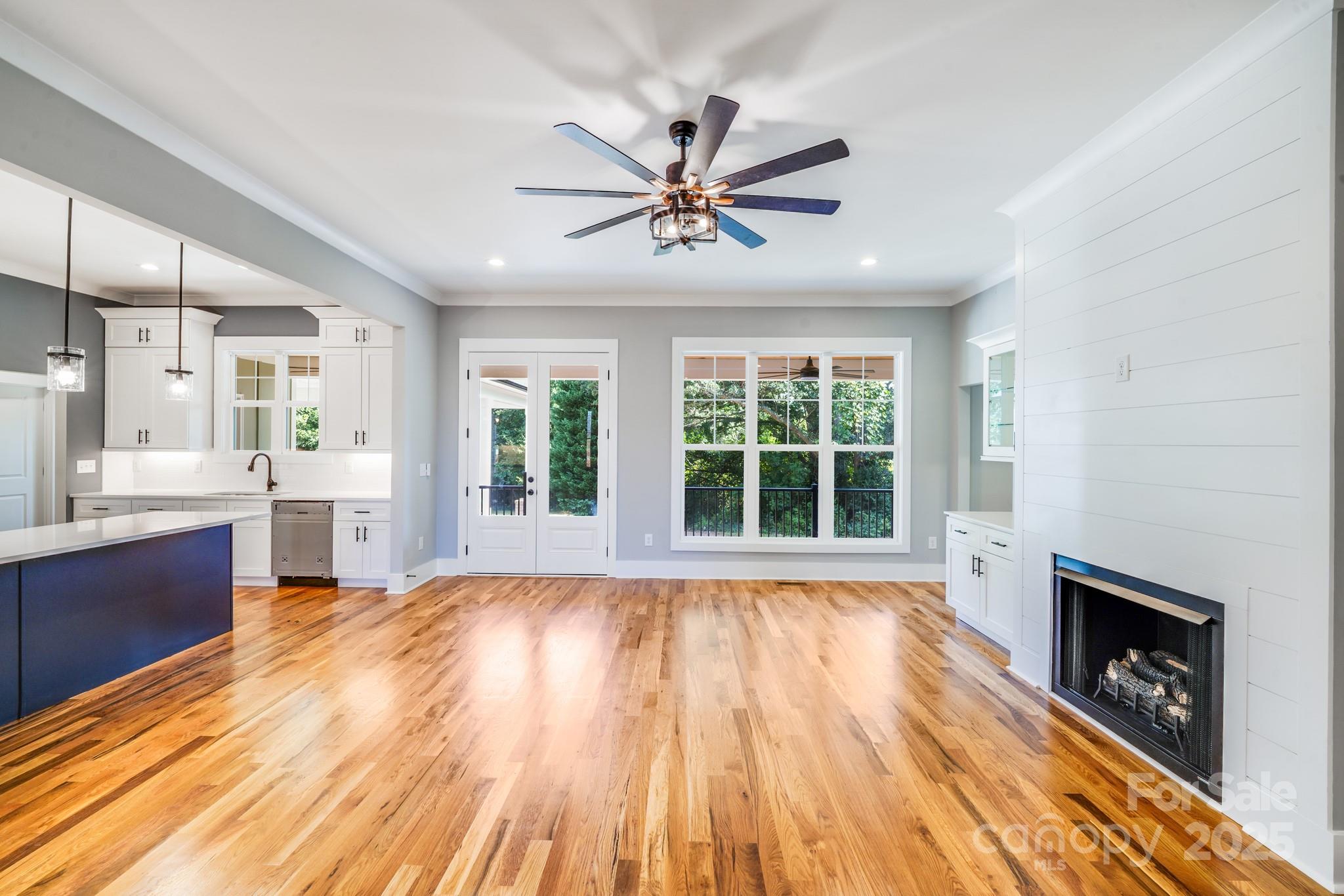 203 Nixon Road Belmont, NC 28012 - Photo 11 of 47 a view of a livingroom with wooden floor and a kitchen
