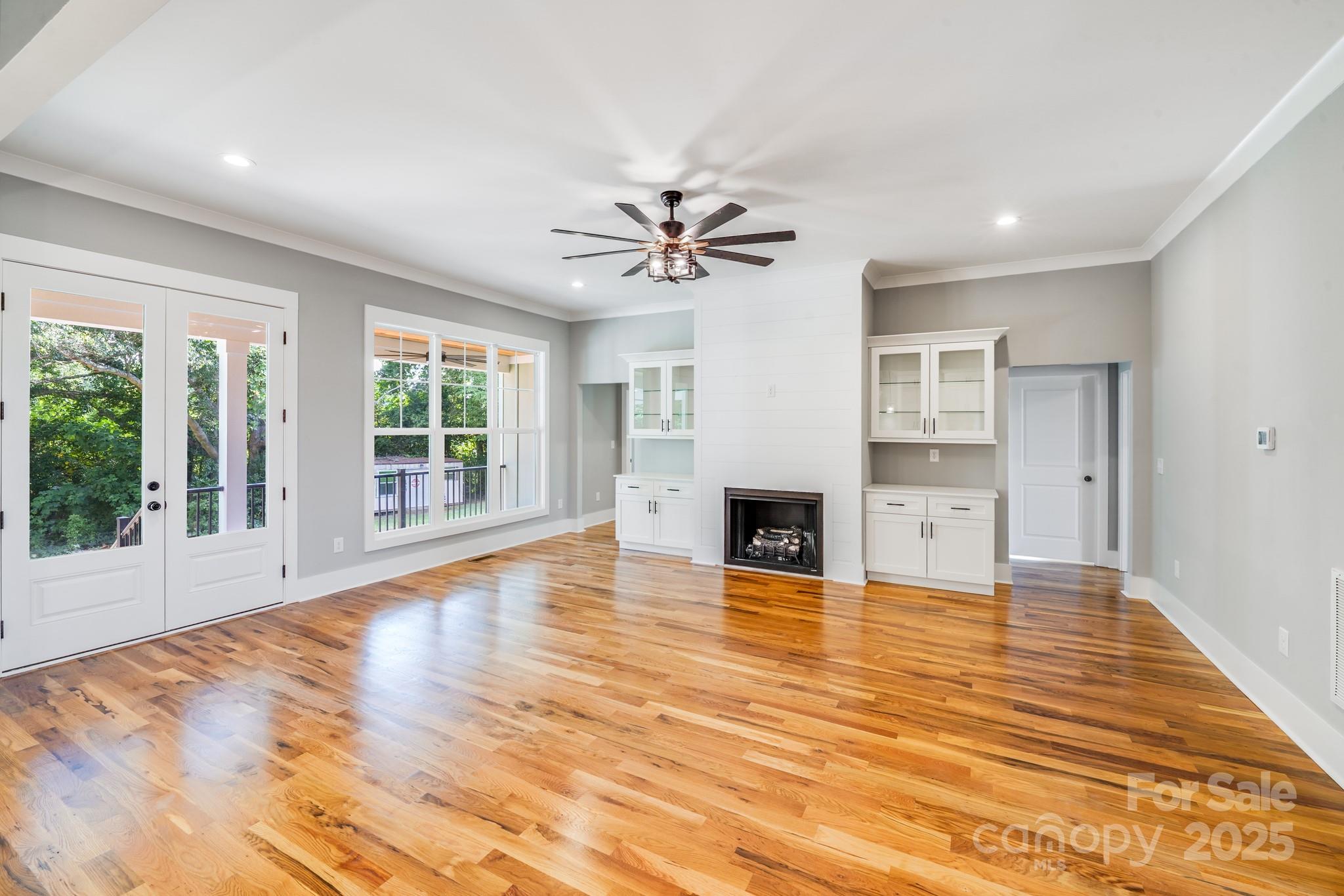 203 Nixon Road Belmont, NC 28012 - Photo 14 of 47 a view of empty room with wooden floor and fan