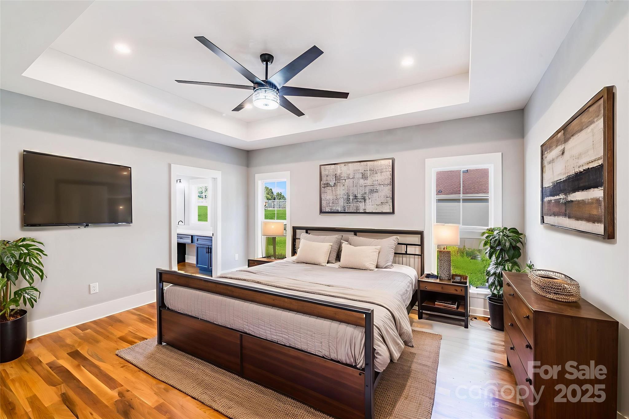 203 Nixon Road Belmont, NC 28012 - Photo 23 of 47 a bedroom with a bed a couch and a flat screen tv