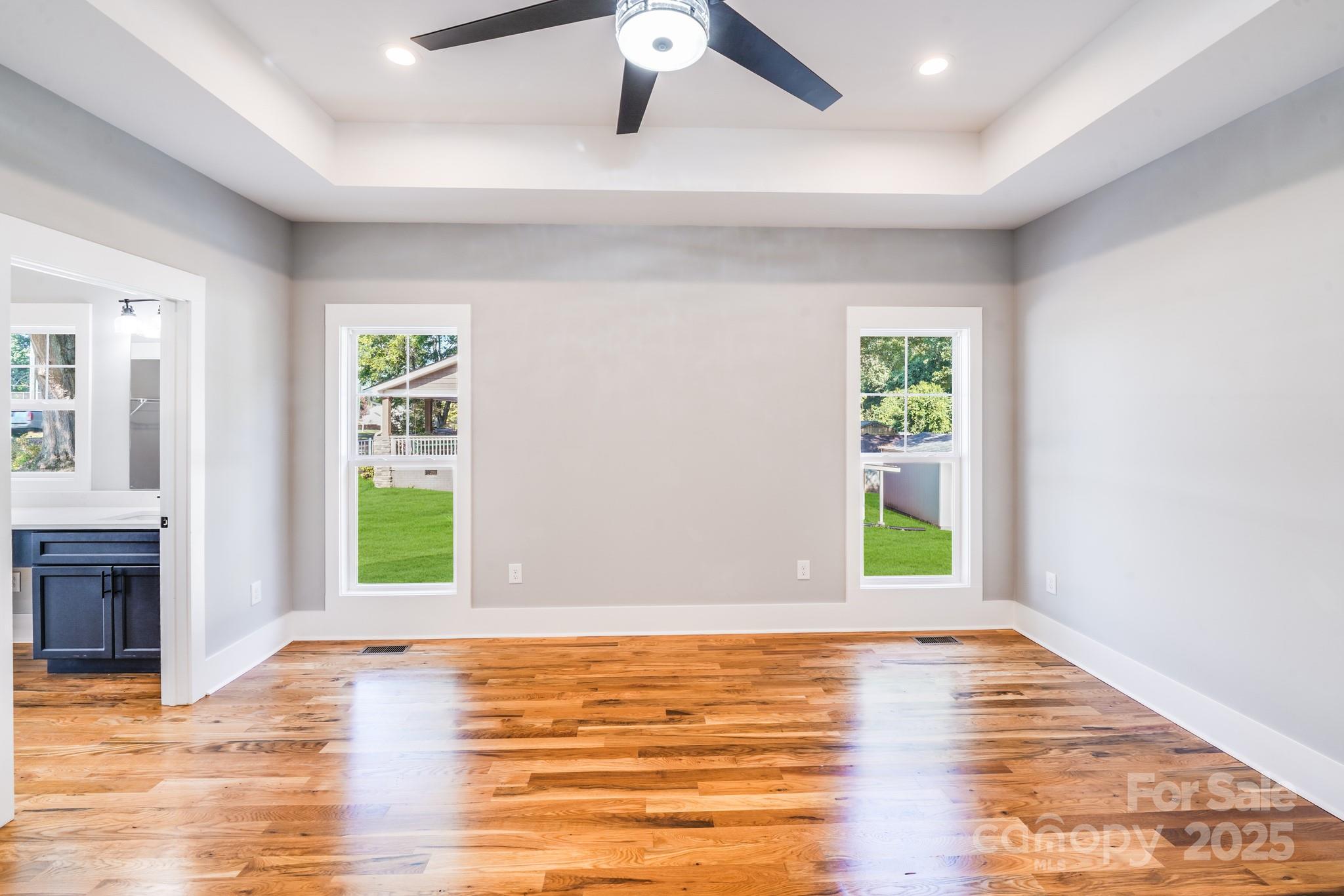 203 Nixon Road Belmont, NC 28012 - Photo 26 of 47 a view of an empty room with window and wooden floor