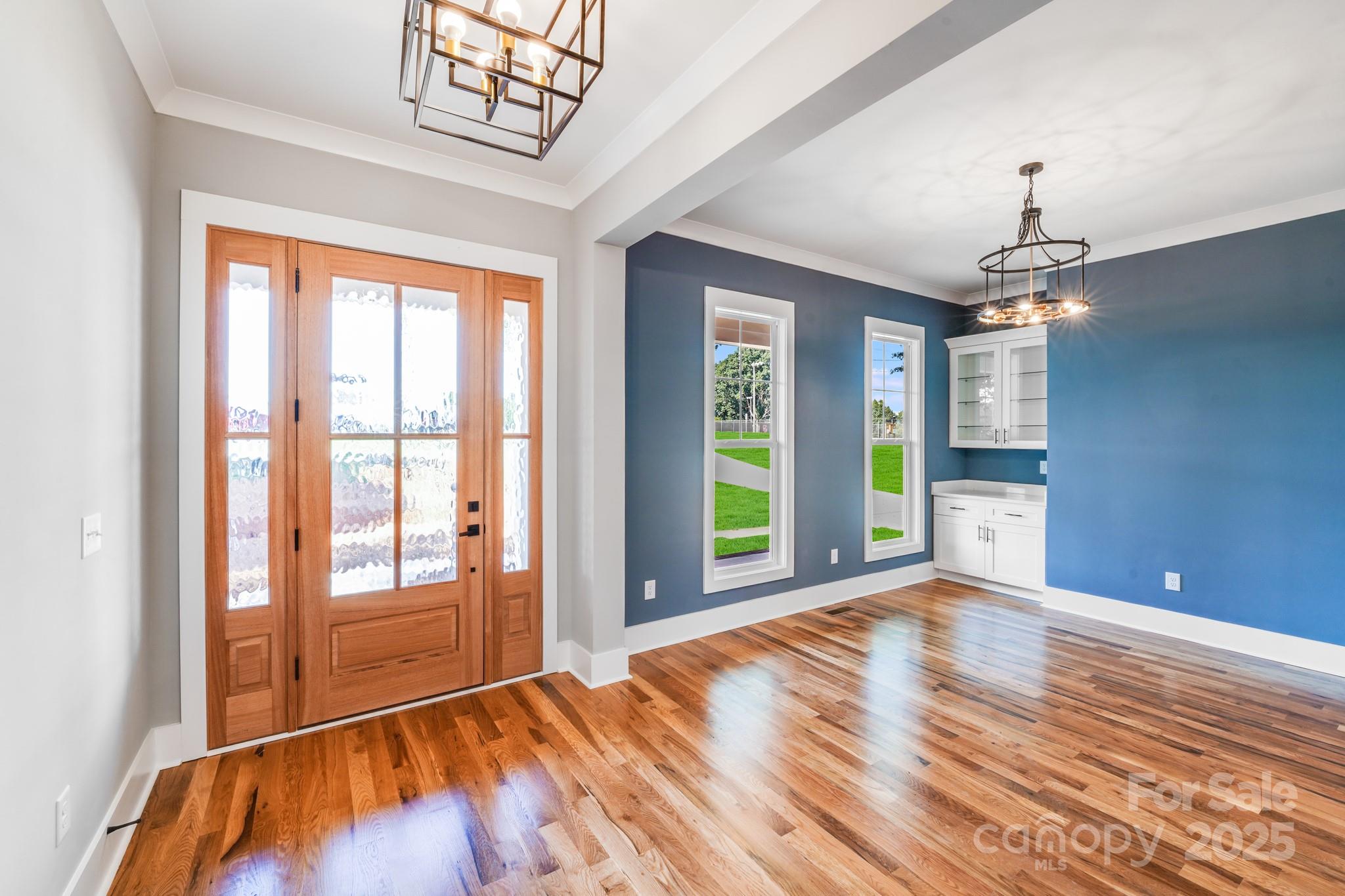 203 Nixon Road Belmont, NC 28012 - Photo 3 of 47 a view of an empty room with a window and wooden floor