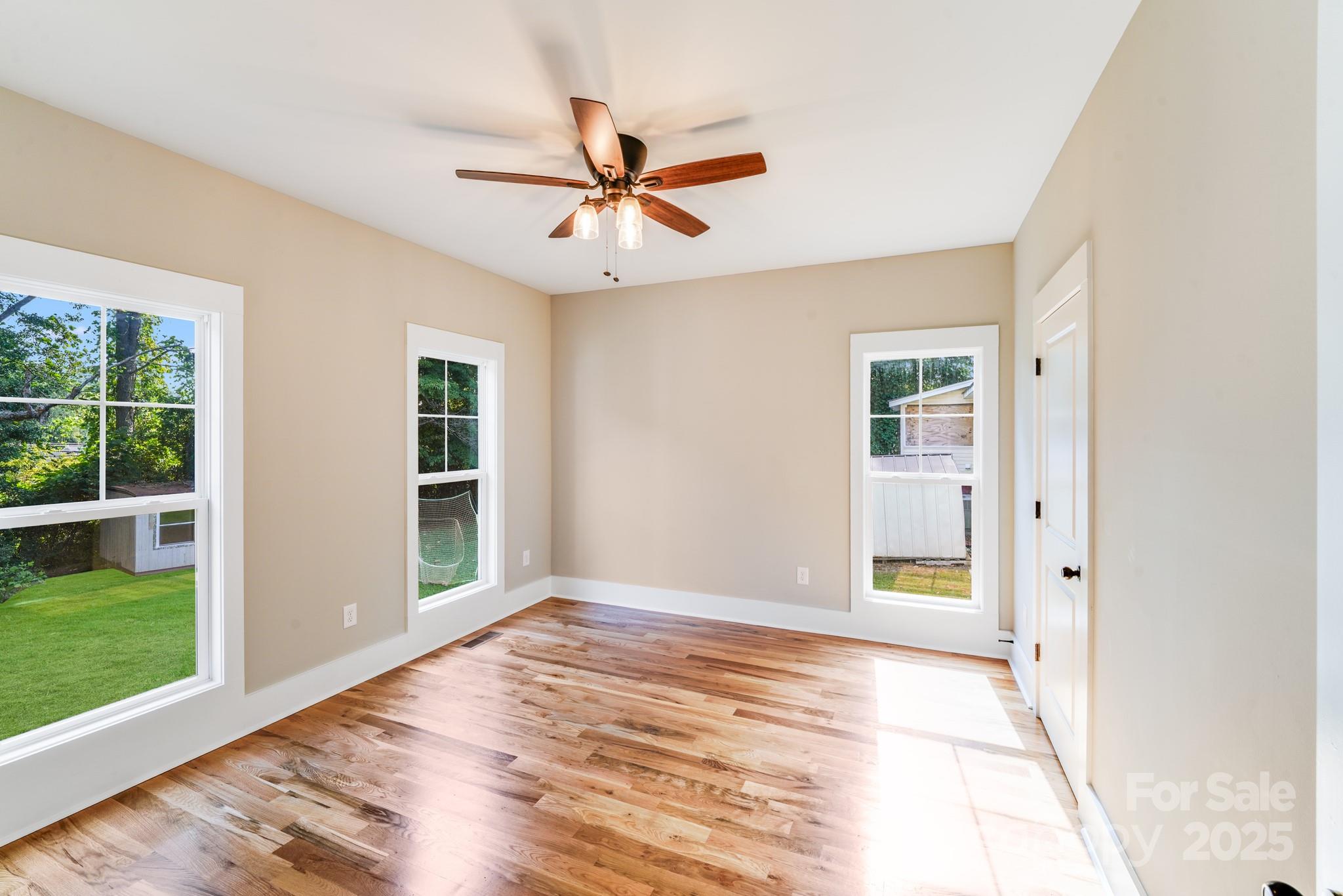 203 Nixon Road Belmont, NC 28012 - Photo 33 of 47 a view of an empty room with window and wooden floor