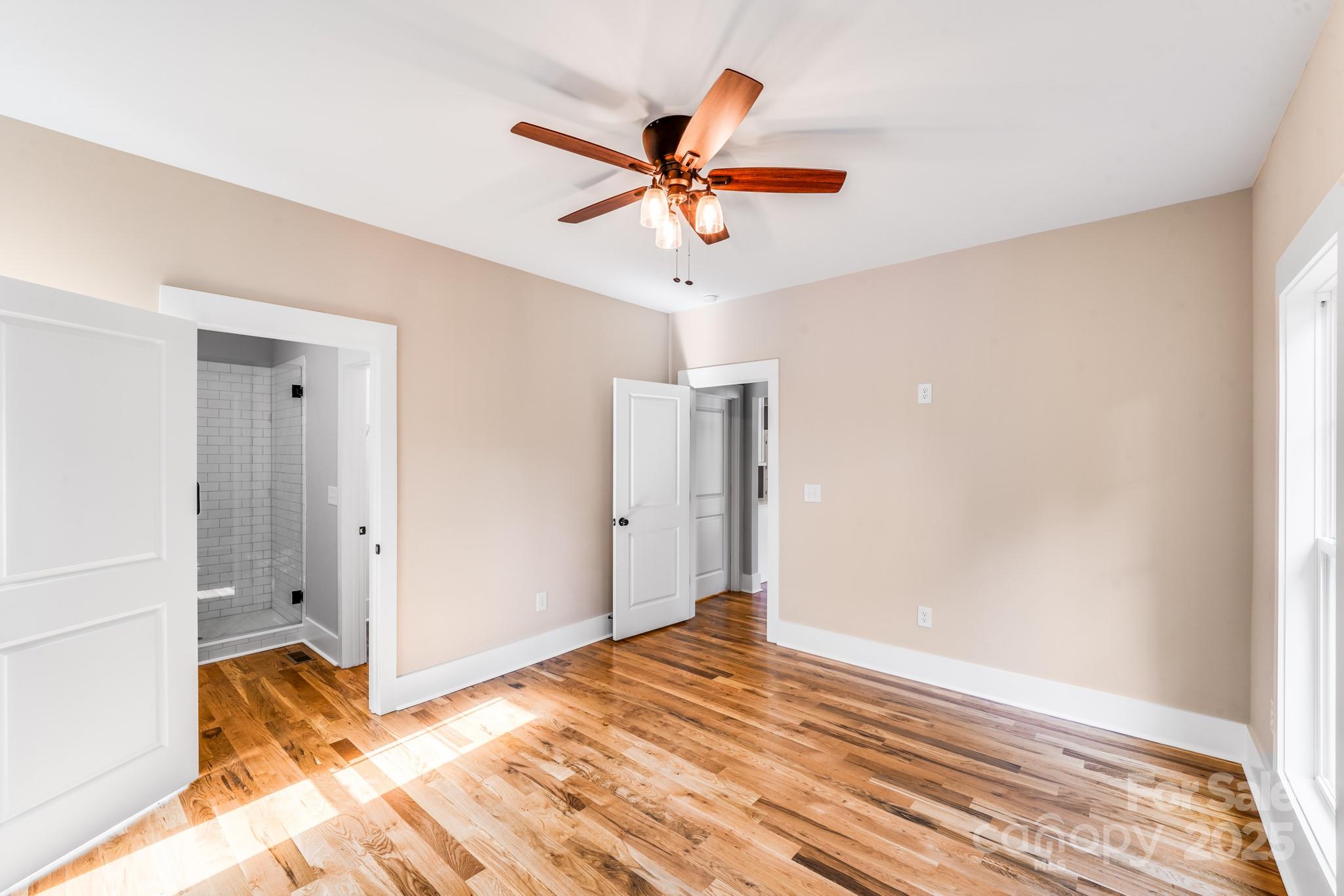 203 Nixon Road Belmont, NC 28012 - Photo 34 of 47 a view of a livingroom with wooden floor and a ceiling fan