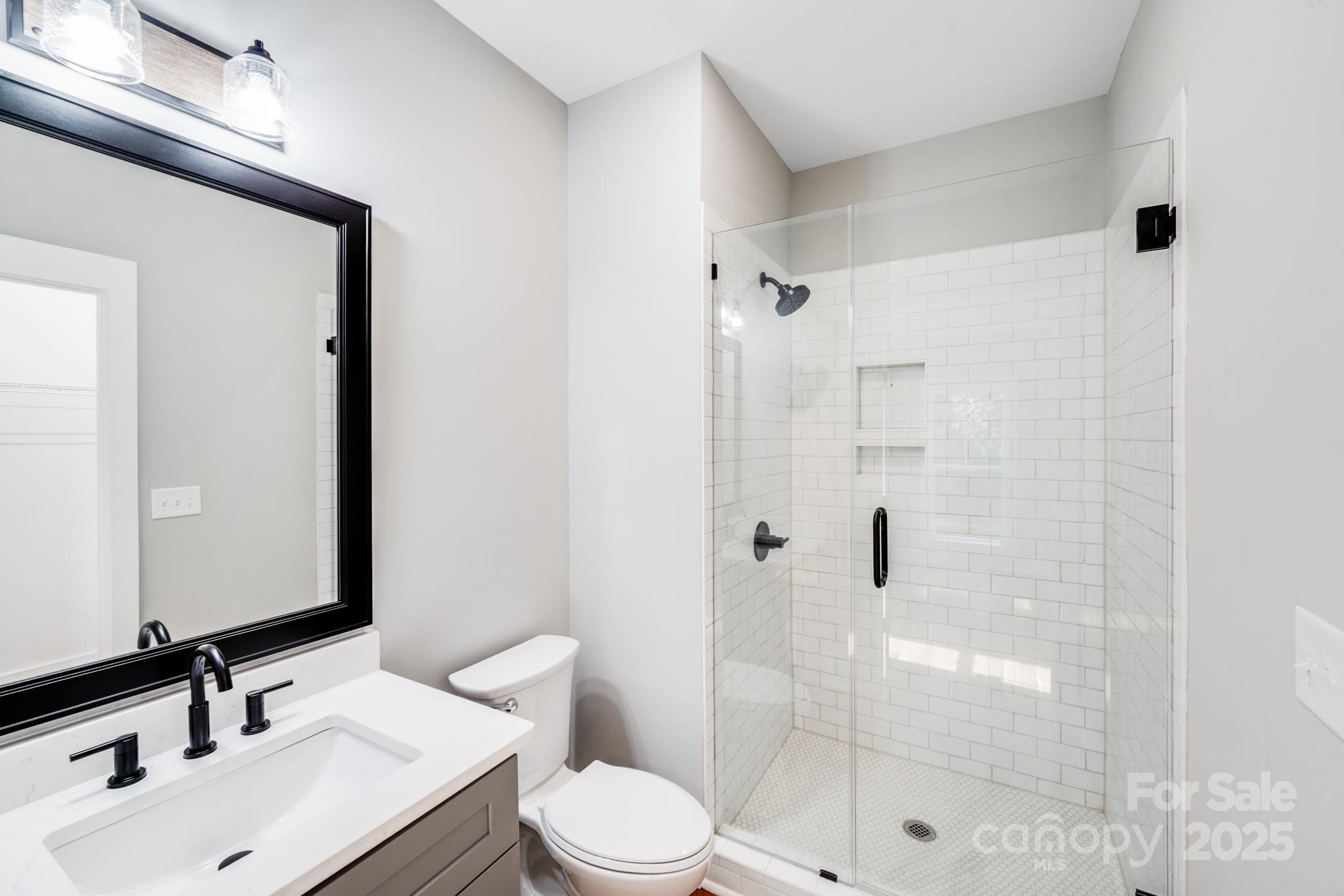 203 Nixon Road Belmont, NC 28012 - Photo 35 of 47 a bathroom with a sink and a mirror