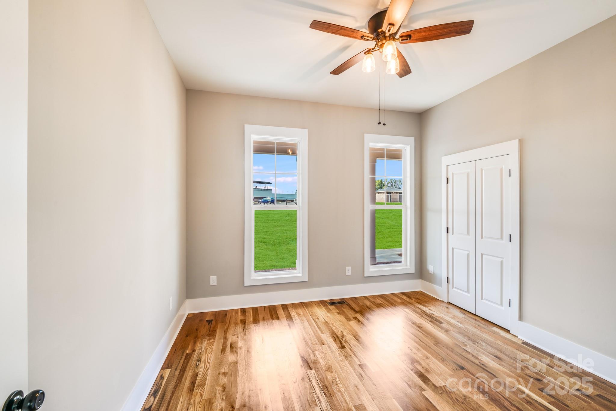 203 Nixon Road Belmont, NC 28012 - Photo 39 of 47 a view of an empty room with window and chandelier fan