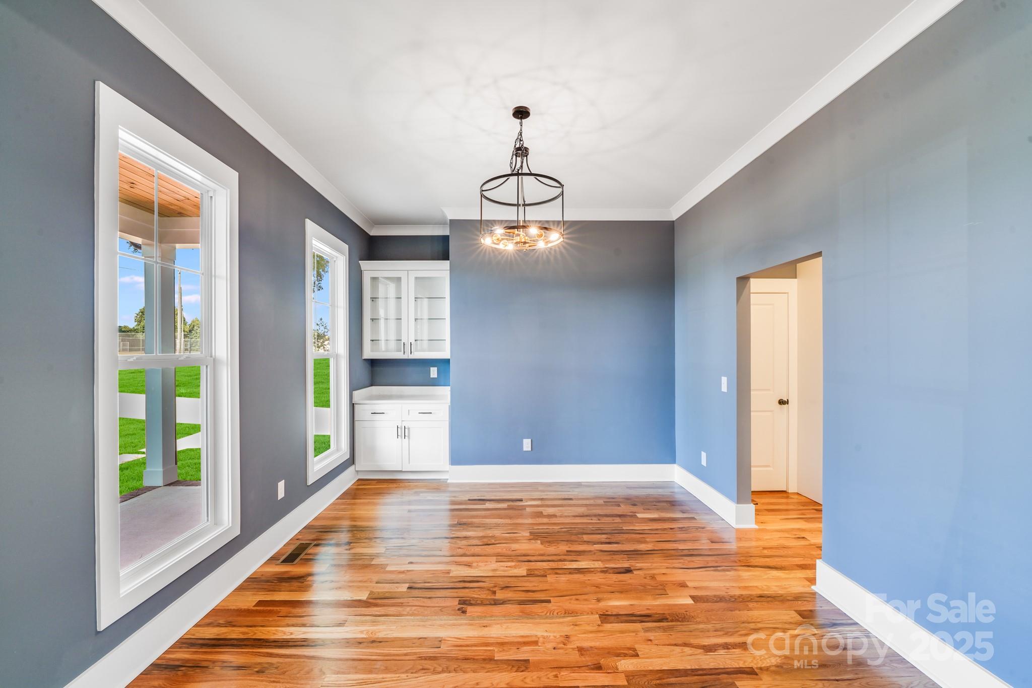 203 Nixon Road Belmont, NC 28012 - Photo 5 of 47 a view of a livingroom with wooden floor and windows