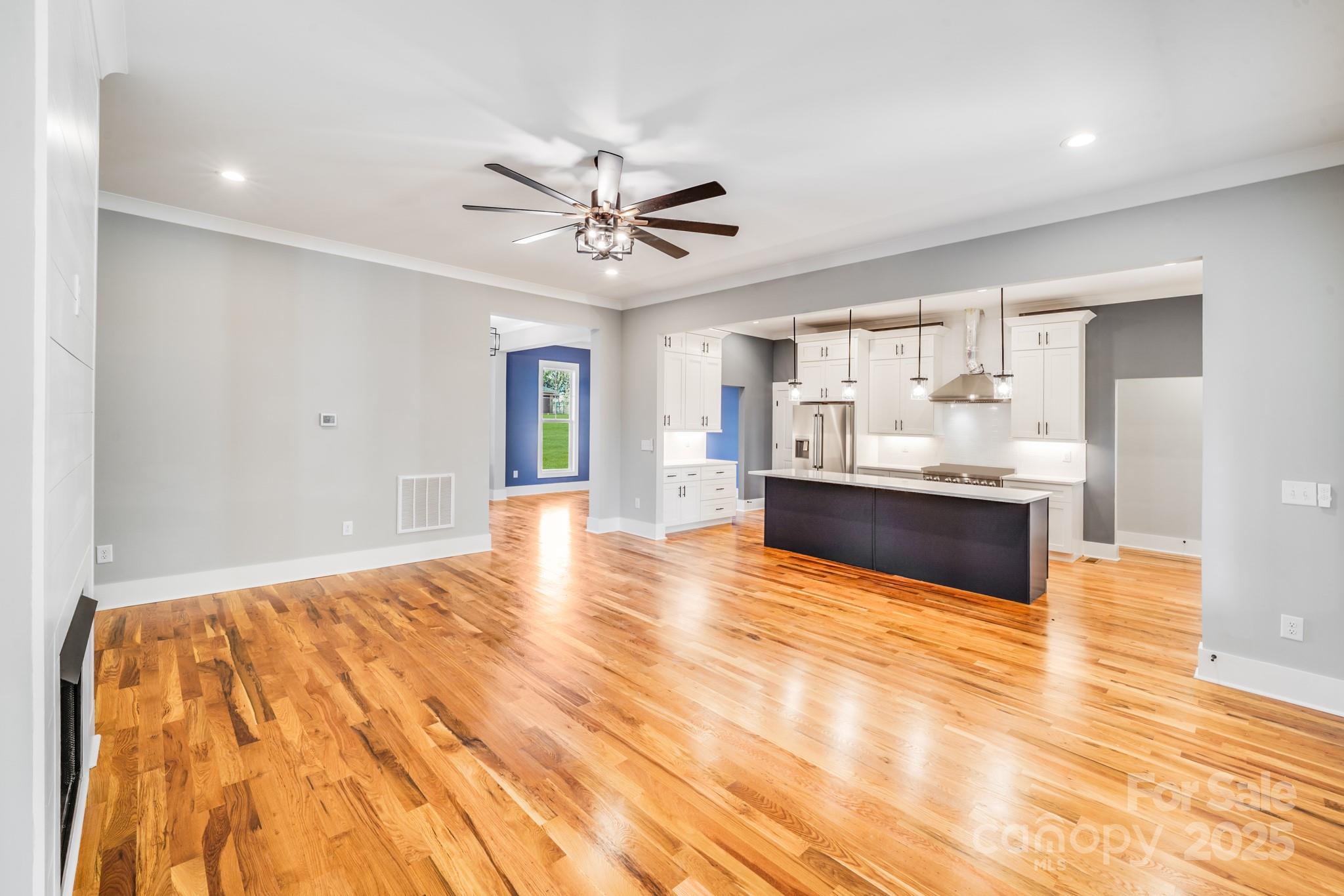 203 Nixon Road Belmont, NC 28012 - Photo 10 of 47 a view of an empty room with window and wooden floor