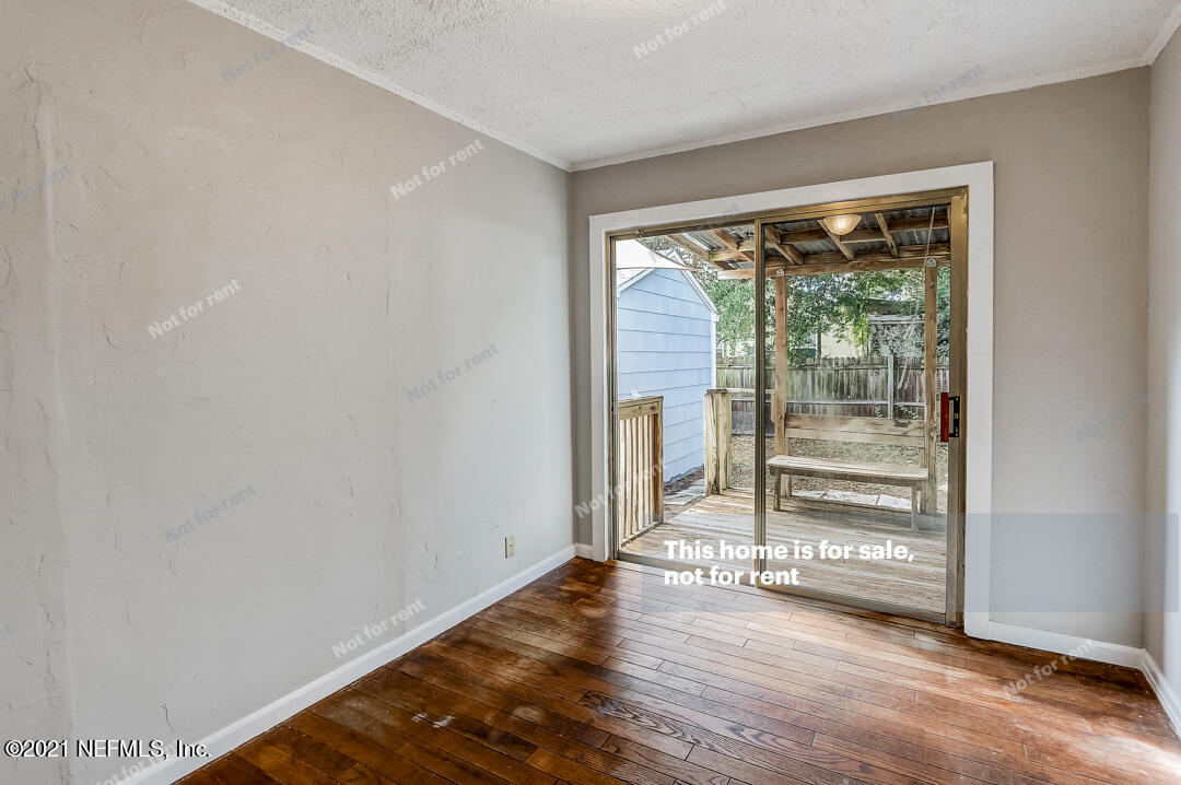 4617 Pinewood Road Jacksonville, FL 32210 - Photo 14 of 18 a view of wooden floor and brick walls