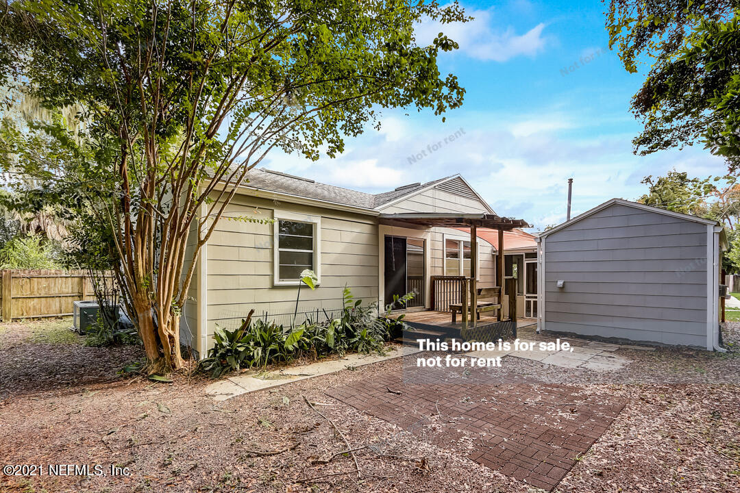 4617 Pinewood Road Jacksonville, FL 32210 - Photo 5 of 18 a front view of a house with garden
