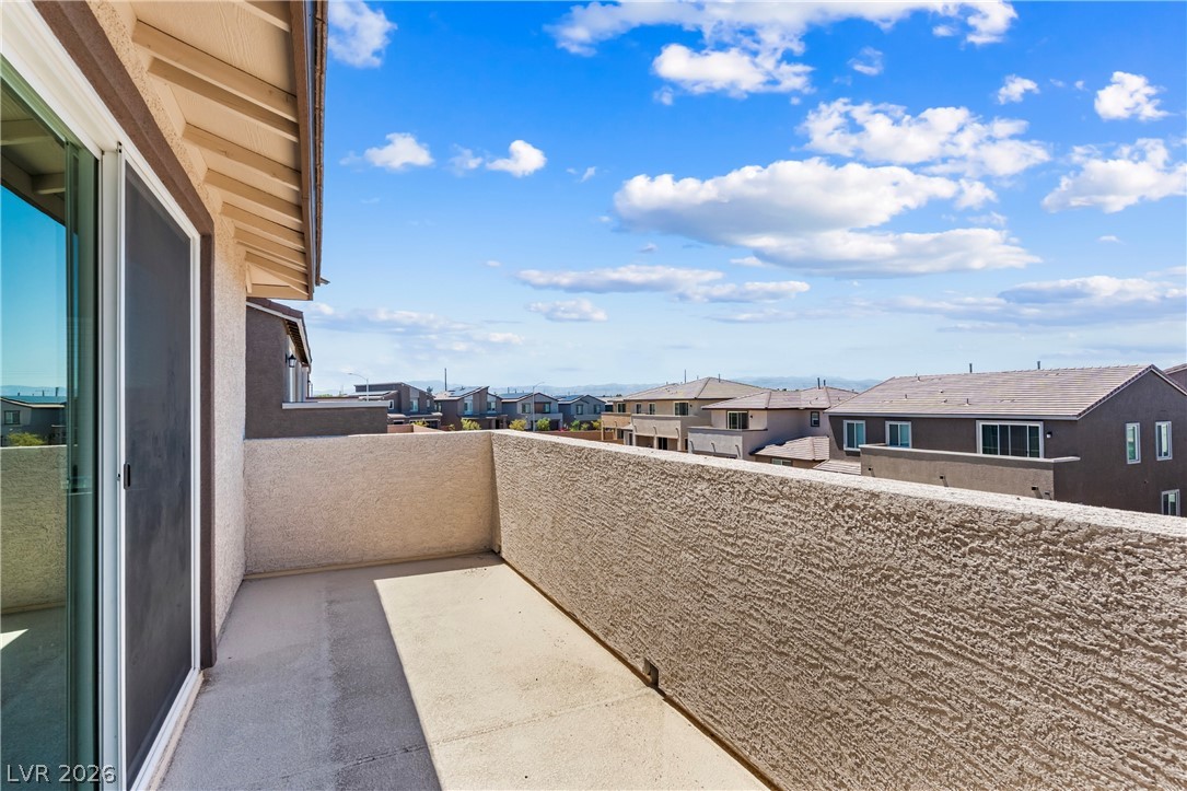 320 Isla Enclave Way Henderson, NV 89011 - Photo 26 of 49 Enjoy the expansive neighborhood vista from this private outdoor deck, perfect for relaxation.