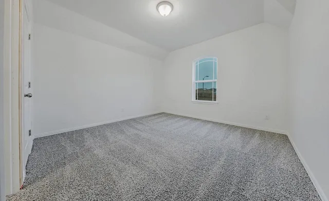 a view of empty room with windows