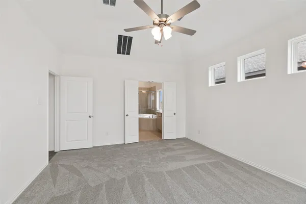 an empty room with a empty space and windows