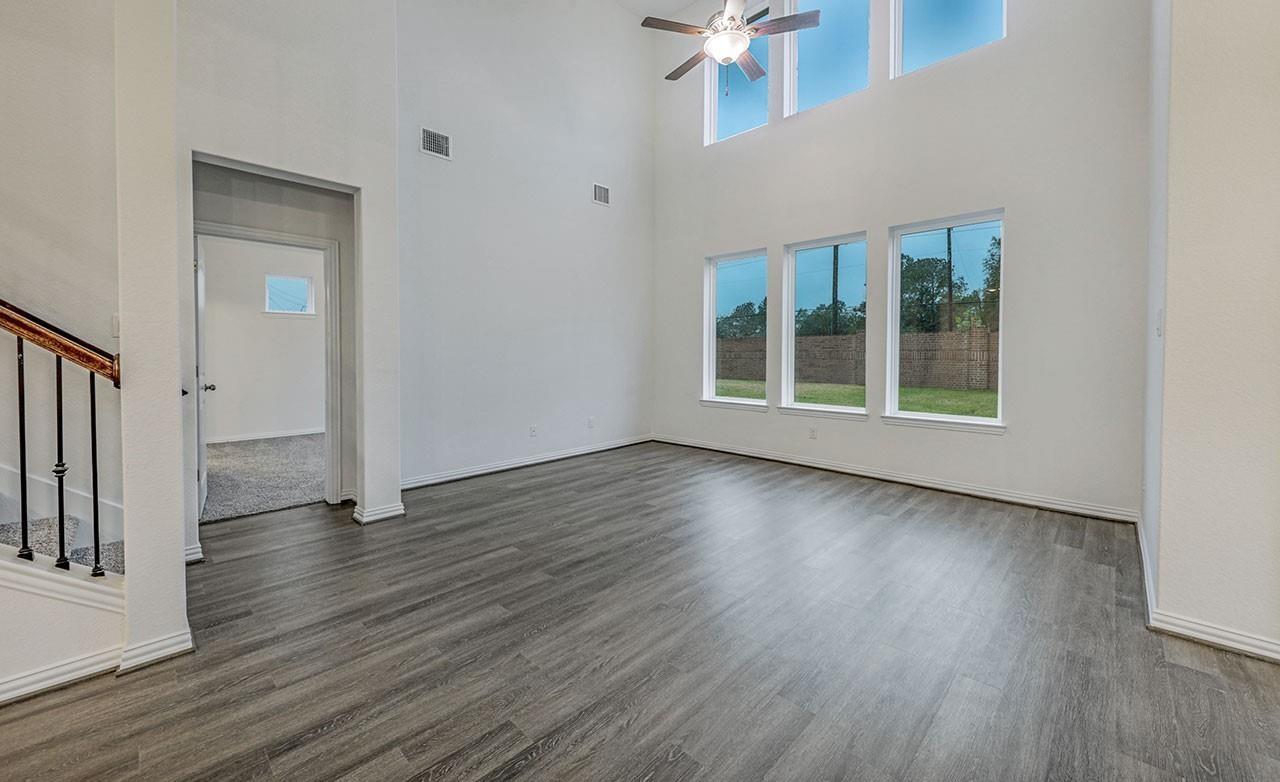 21119 Sunlight Grv Drive Rosharon, TX 77583 - Photo 6 of 14 a view of an empty room with wooden floor and a window