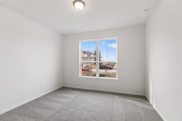 a large kitchen with stainless steel appliances granite countertop a lot of counter space and wooden floors