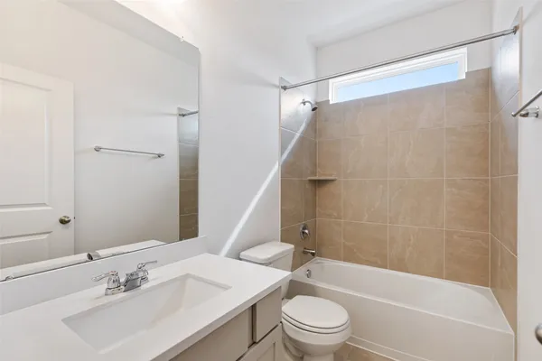 a large kitchen with stainless steel appliances granite countertop a stove a sink and a refrigerator