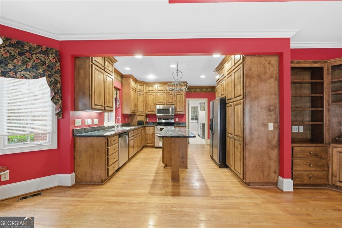2040 Wynbrooke Place Madison, GA 30650 - Photo 19 of 60 a kitchen with stainless steel appliances granite countertop a refrigerator and a stove top oven