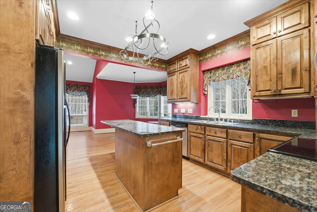2040 Wynbrooke Place Madison, GA 30650 - Photo 23 of 60 a kitchen with stainless steel appliances granite countertop a sink and counter space