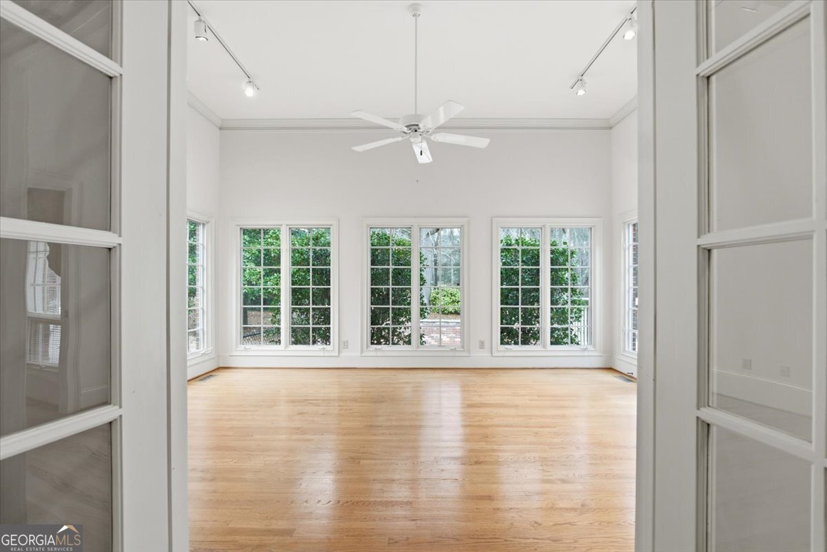 2040 Wynbrooke Place Madison, GA 30650 - Photo 26 of 60 a view of an empty room with a window and kitchen view