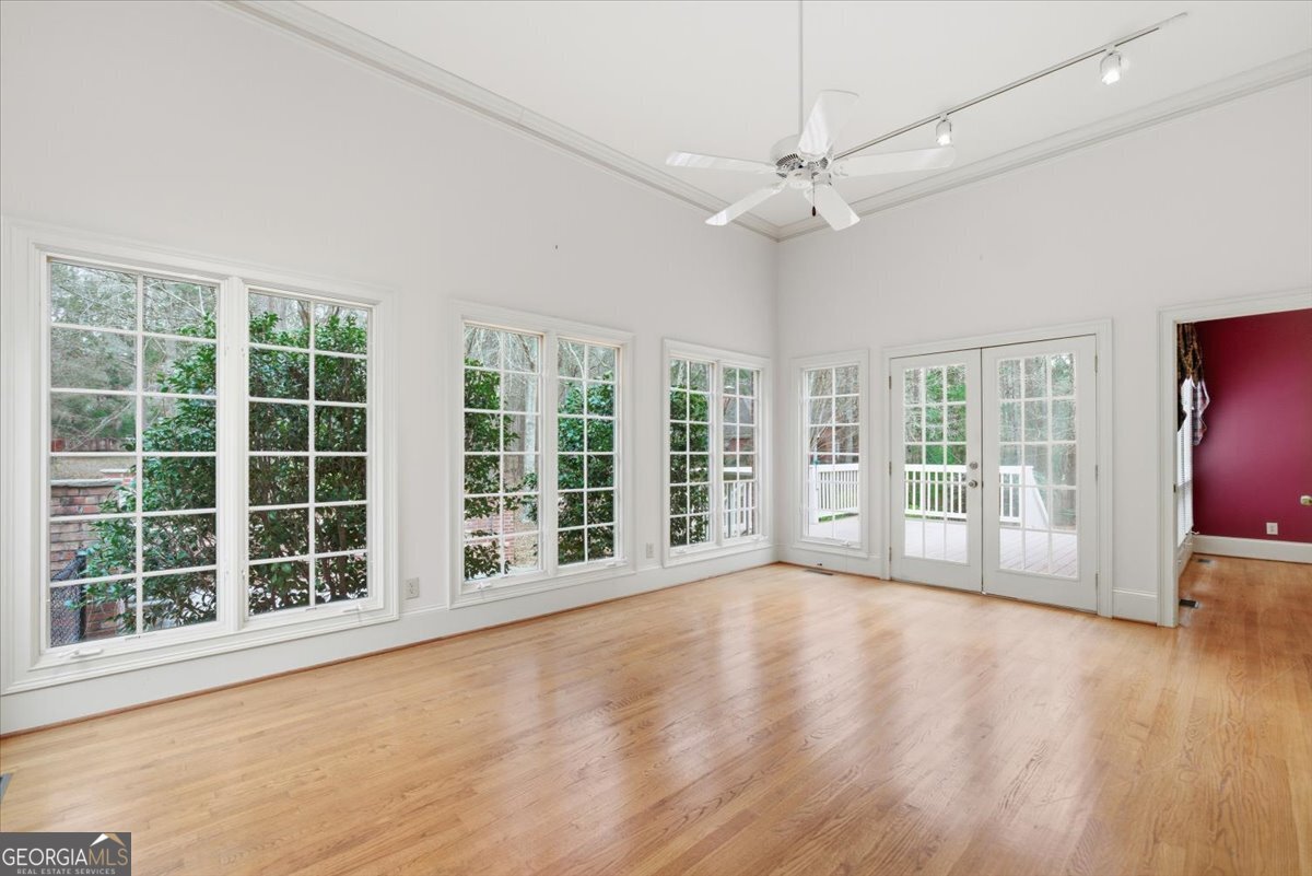 2040 Wynbrooke Place Madison, GA 30650 - Photo 27 of 60 a view of an empty room with a window and wooden floor