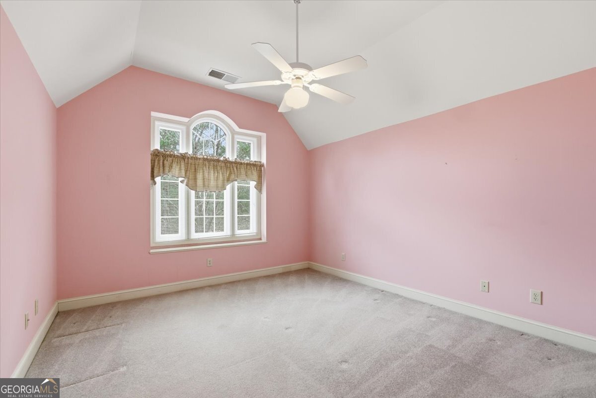 2040 Wynbrooke Place Madison, GA 30650 - Photo 28 of 60 an empty room with windows and fan