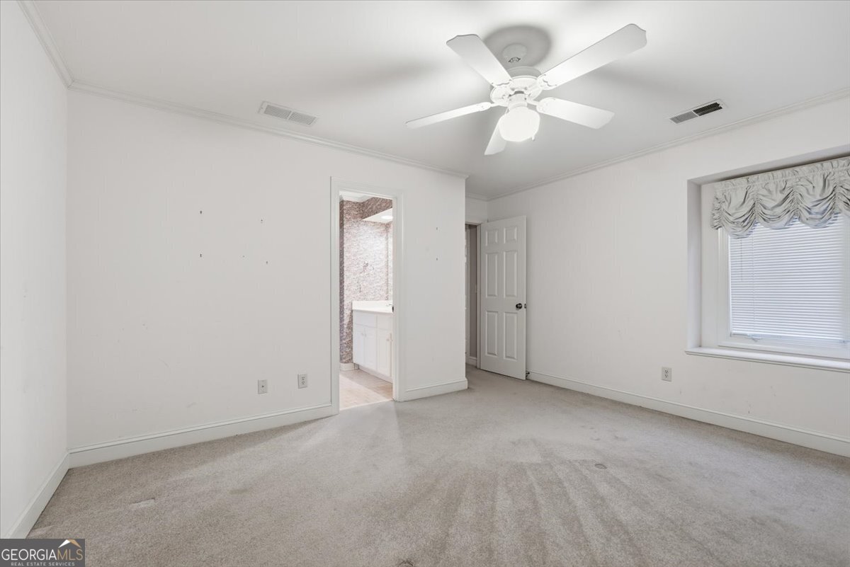 2040 Wynbrooke Place Madison, GA 30650 - Photo 32 of 60 a view of an empty room with a window