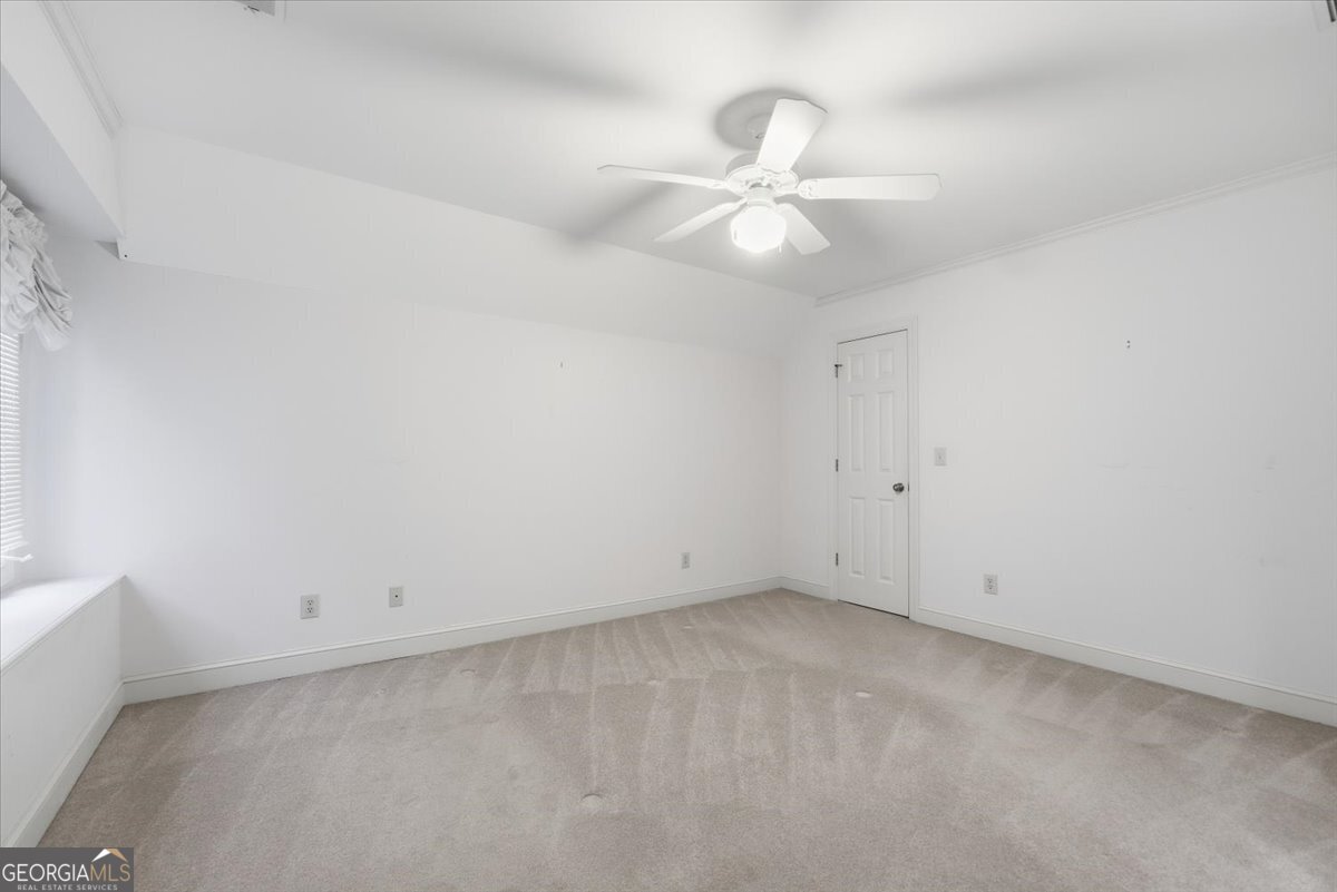 2040 Wynbrooke Place Madison, GA 30650 - Photo 33 of 60 an empty room with a window and a fan