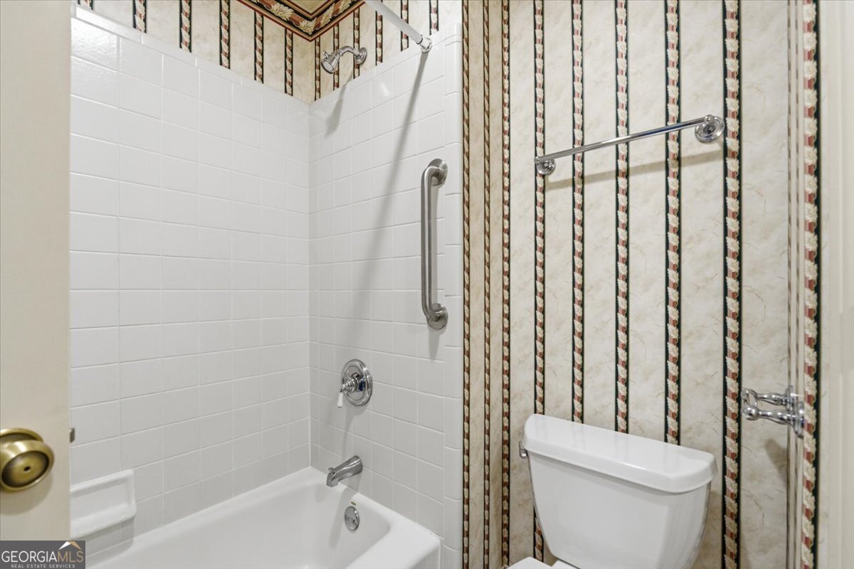 2040 Wynbrooke Place Madison, GA 30650 - Photo 37 of 60 a bathroom with a toilet and shower
