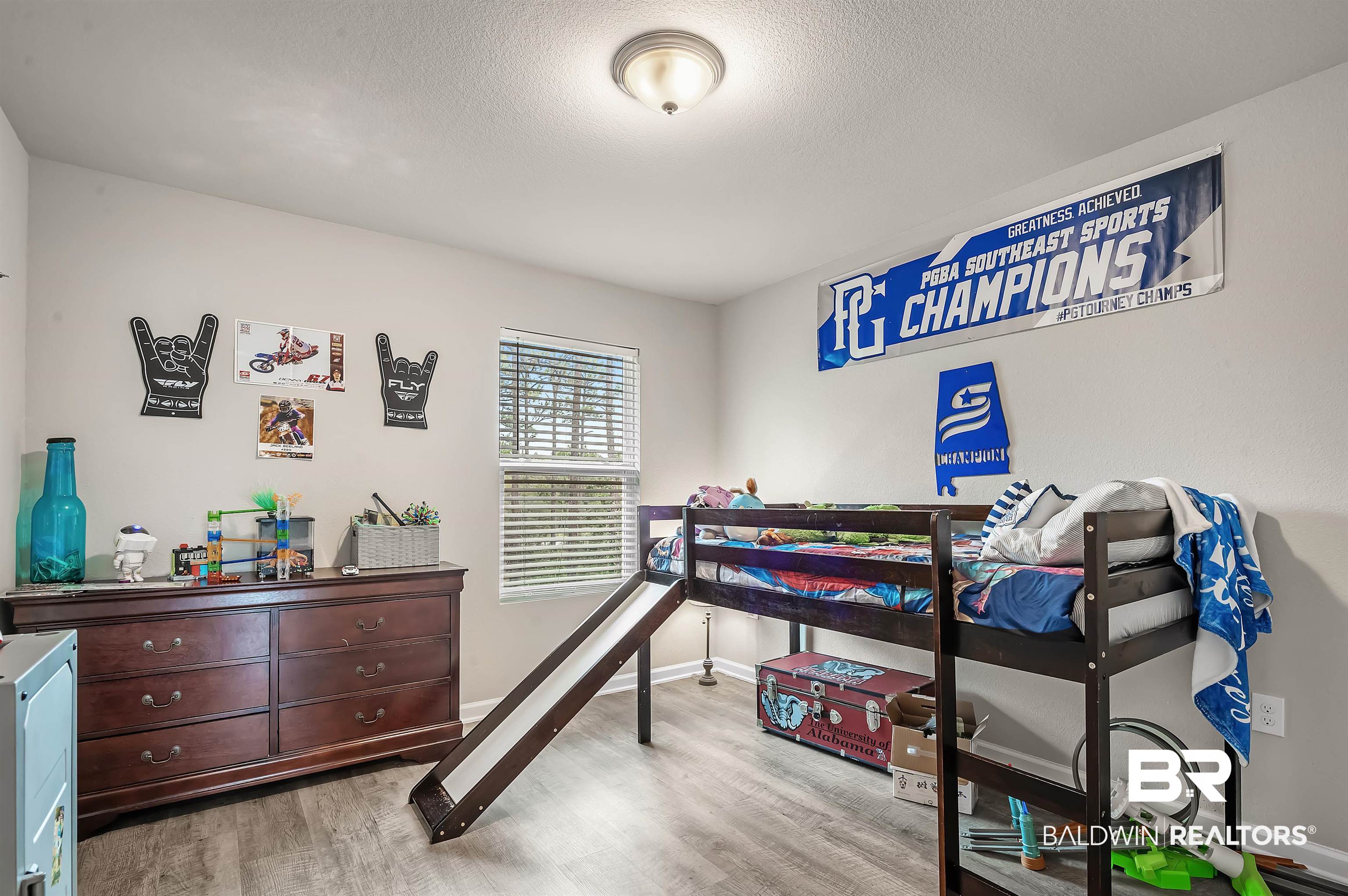 24549 Broken Sound Loop Orange Beach, AL 36561 - Photo 41 of 57 Bedroom featuring light hardwood / wood-style floors and a textured ceiling