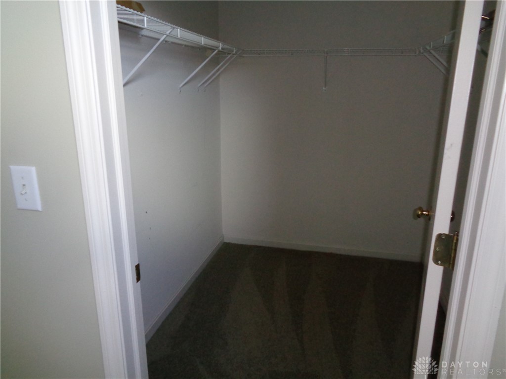 80 Villa Pointe Drive Springboro, OH 45066 - Photo 16 of 19 An organized closet offers ample storage with wire shelving and plush carpeting.