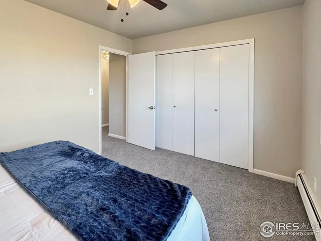 a bathroom with a granite countertop tub sink and mirror