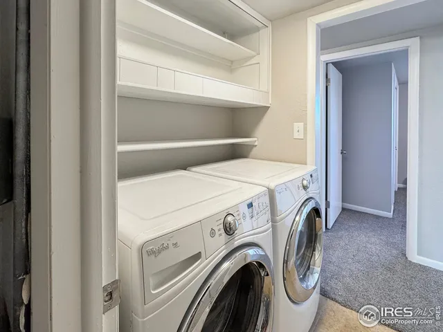 an empty room with a ceiling fan and a window