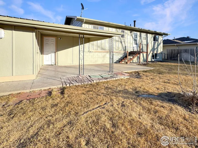 a view of an chairs in the backyard