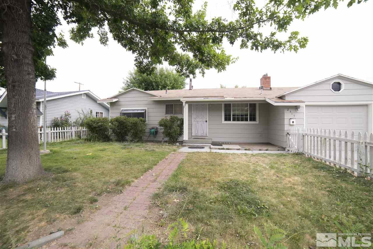 2415 Trident Way Reno, NV 89512 - Photo 1 of 1 a front view of a house with garden