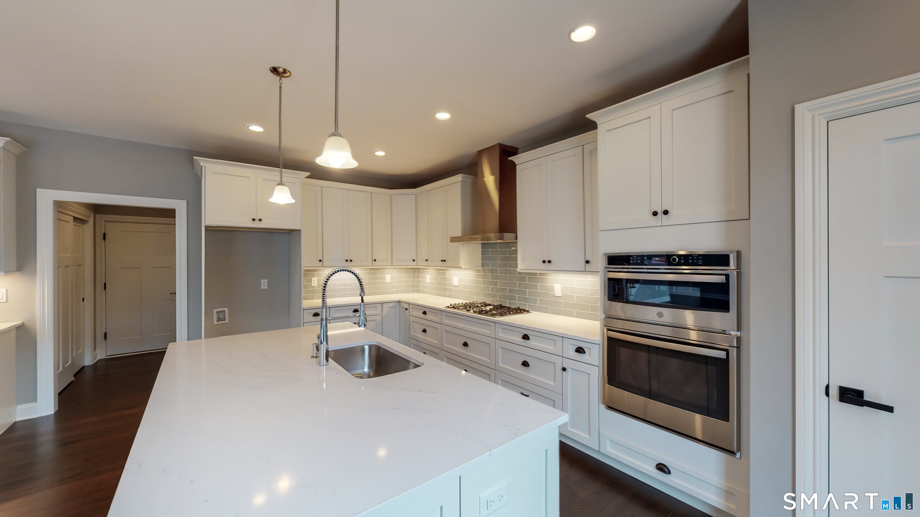 18 Twin Valley Road East Lyme, CT 06333 - Photo 11 of 26 a kitchen with kitchen island a sink stainless steel appliances and cabinets