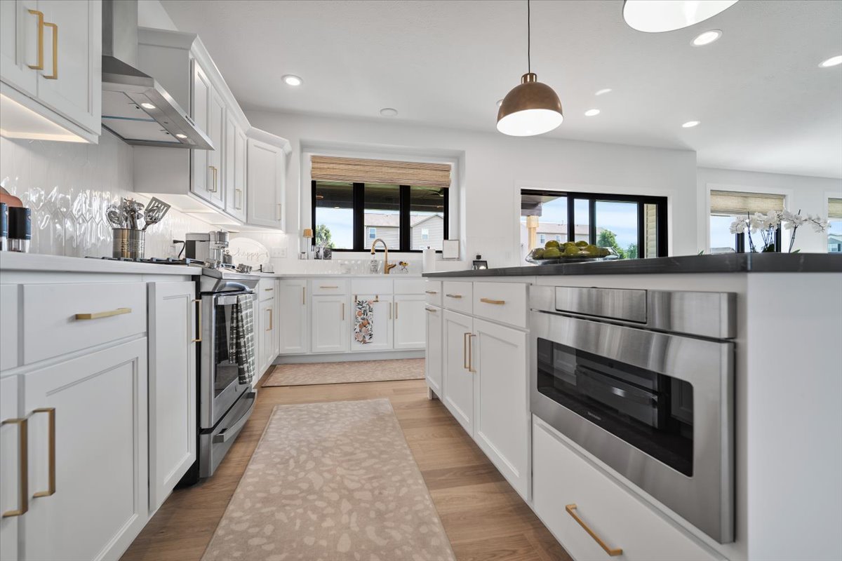5305 Finlen Lane Bloomington, IL 61705 - Photo 12 of 42 a kitchen with stainless steel appliances granite countertop a stove a sink and a refrigerator
