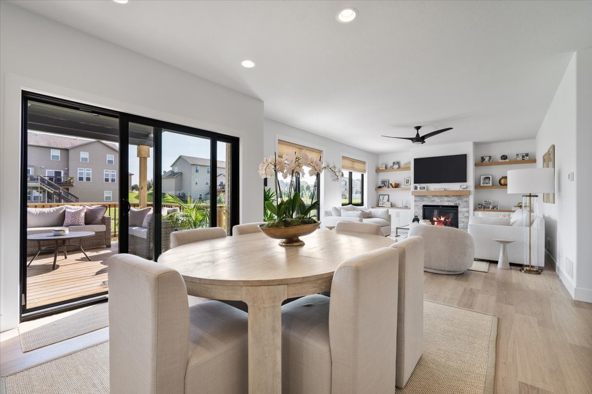 5305 Finlen Lane Bloomington, IL 61705 - Photo 13 of 42 a living room with furniture a fireplace and a flat screen tv