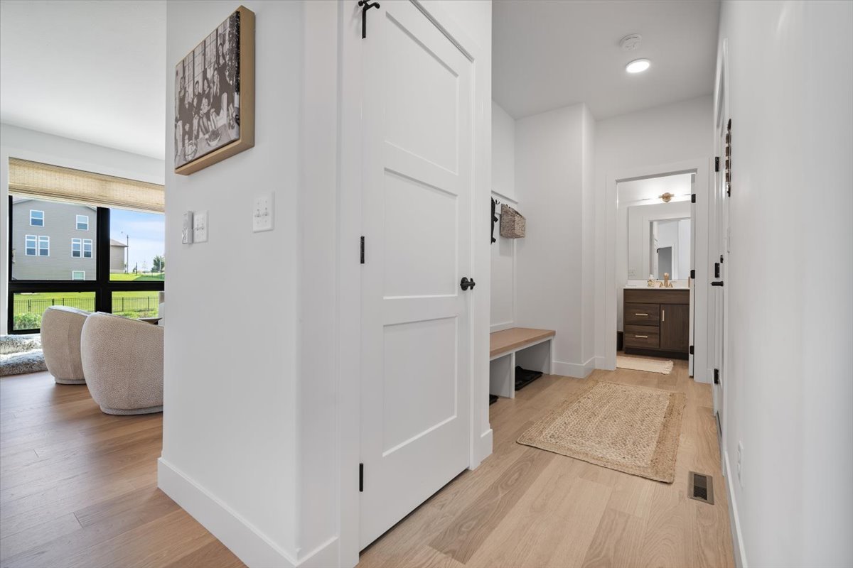 5305 Finlen Lane Bloomington, IL 61705 - Photo 16 of 42 a view of a hallway with wooden floor and furniture