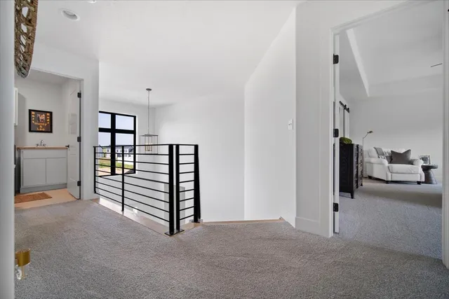 a view of a livingroom with a furniture and staircase