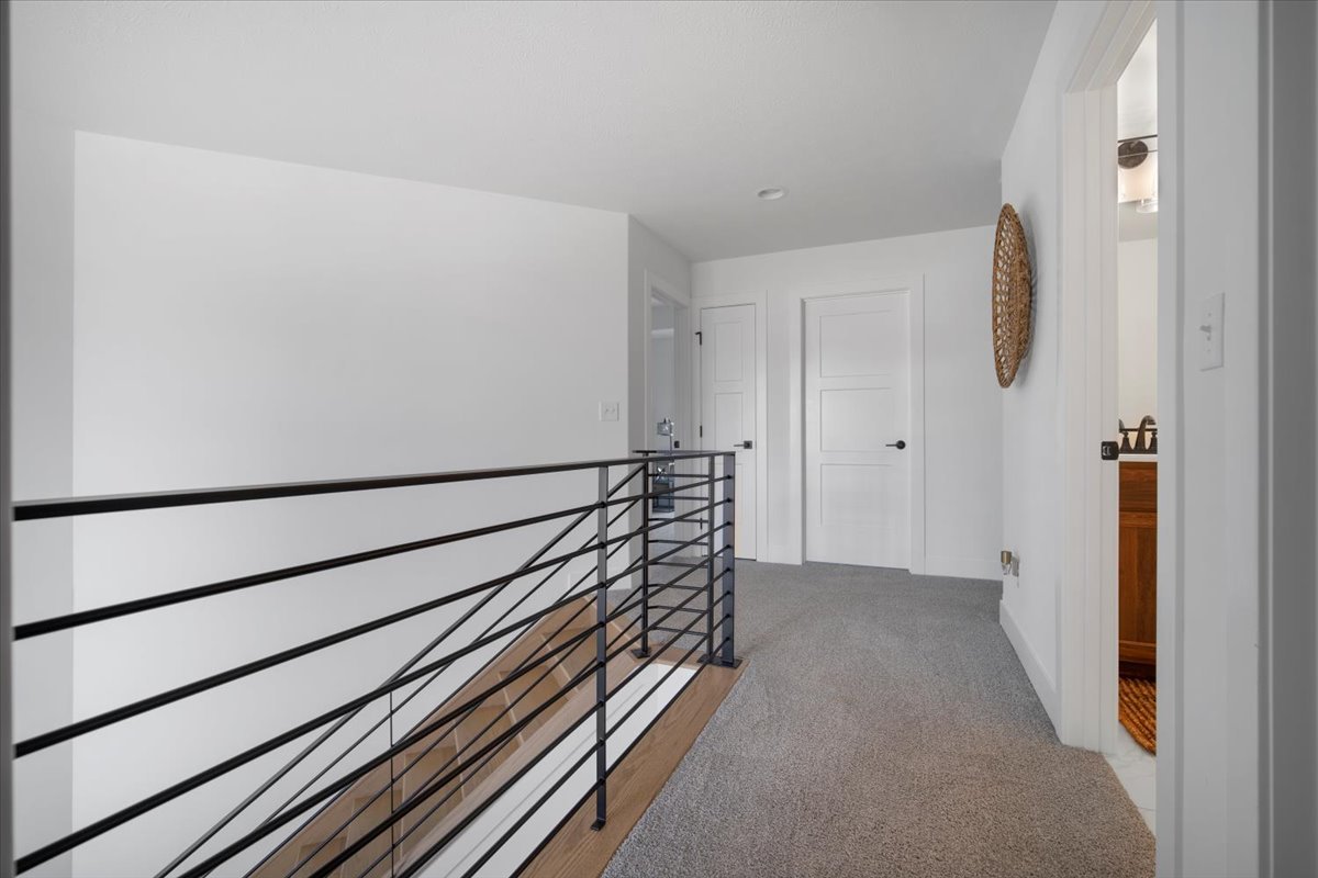 5305 Finlen Lane Bloomington, IL 61705 - Photo 24 of 42 a view of a hallway with wooden floor and stairs