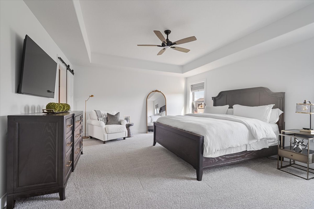 5305 Finlen Lane Bloomington, IL 61705 - Photo 25 of 42 a bedroom with bed and a flat screen tv