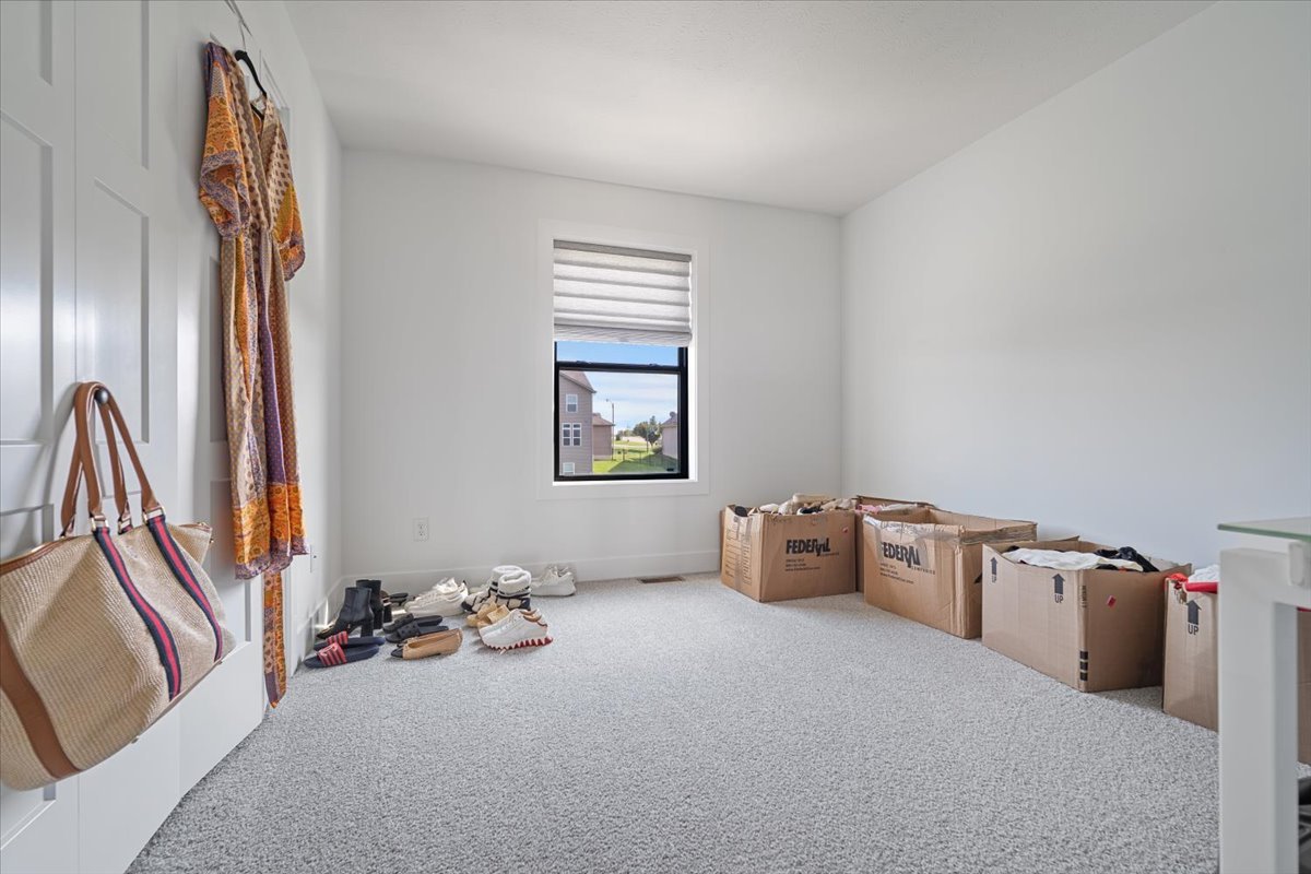 5305 Finlen Lane Bloomington, IL 61705 - Photo 33 of 42 a room with furniture and a window