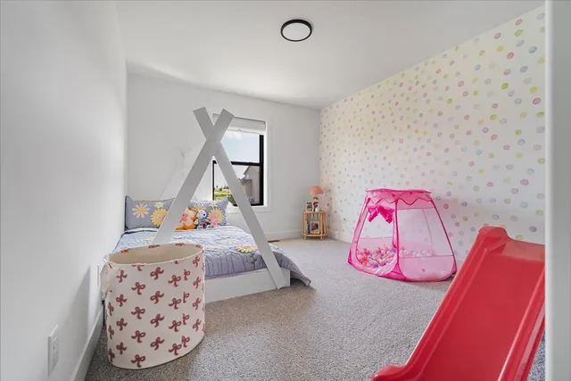 a bedroom with a bed and a couch