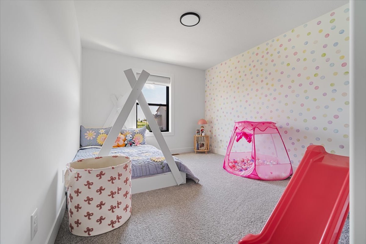 5305 Finlen Lane Bloomington, IL 61705 - Photo 34 of 42 a bedroom with a bed and a couch