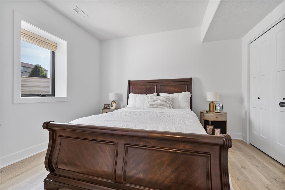 5305 Finlen Lane Bloomington, IL 61705 - Photo 37 of 42 a room with a bed and wooden floor