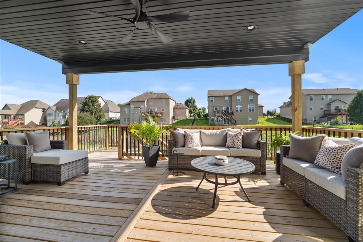 5305 Finlen Lane Bloomington, IL 61705 - Photo 39 of 42 a living room with furniture and a floor to ceiling window