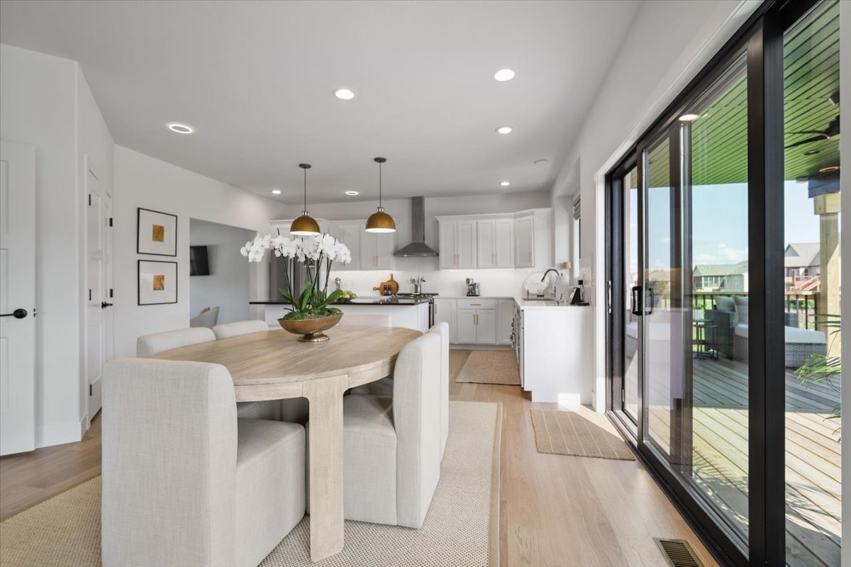 5305 Finlen Lane Bloomington, IL 61705 - Photo 8 of 42 a dining hall with stainless steel appliances granite countertop furniture a large window and kitchen view