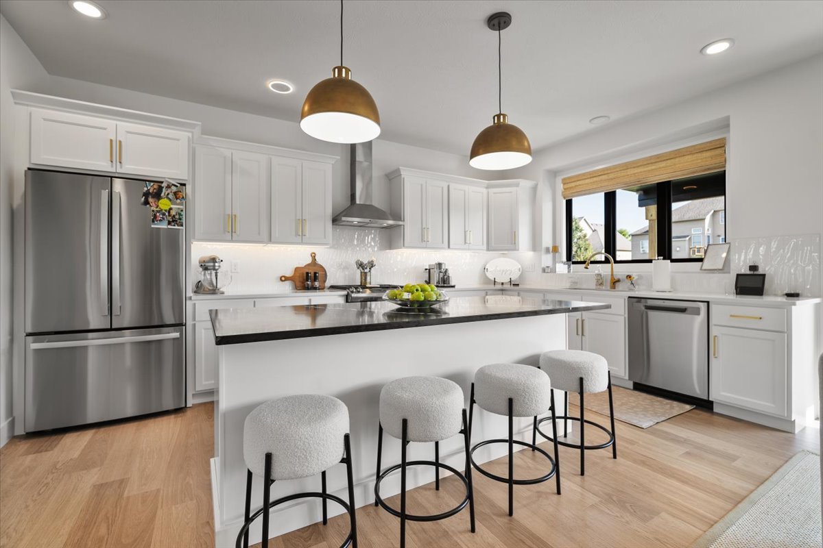 5305 Finlen Lane Bloomington, IL 61705 - Photo 9 of 42 a kitchen with stainless steel appliances granite countertop a sink a stove and a refrigerator